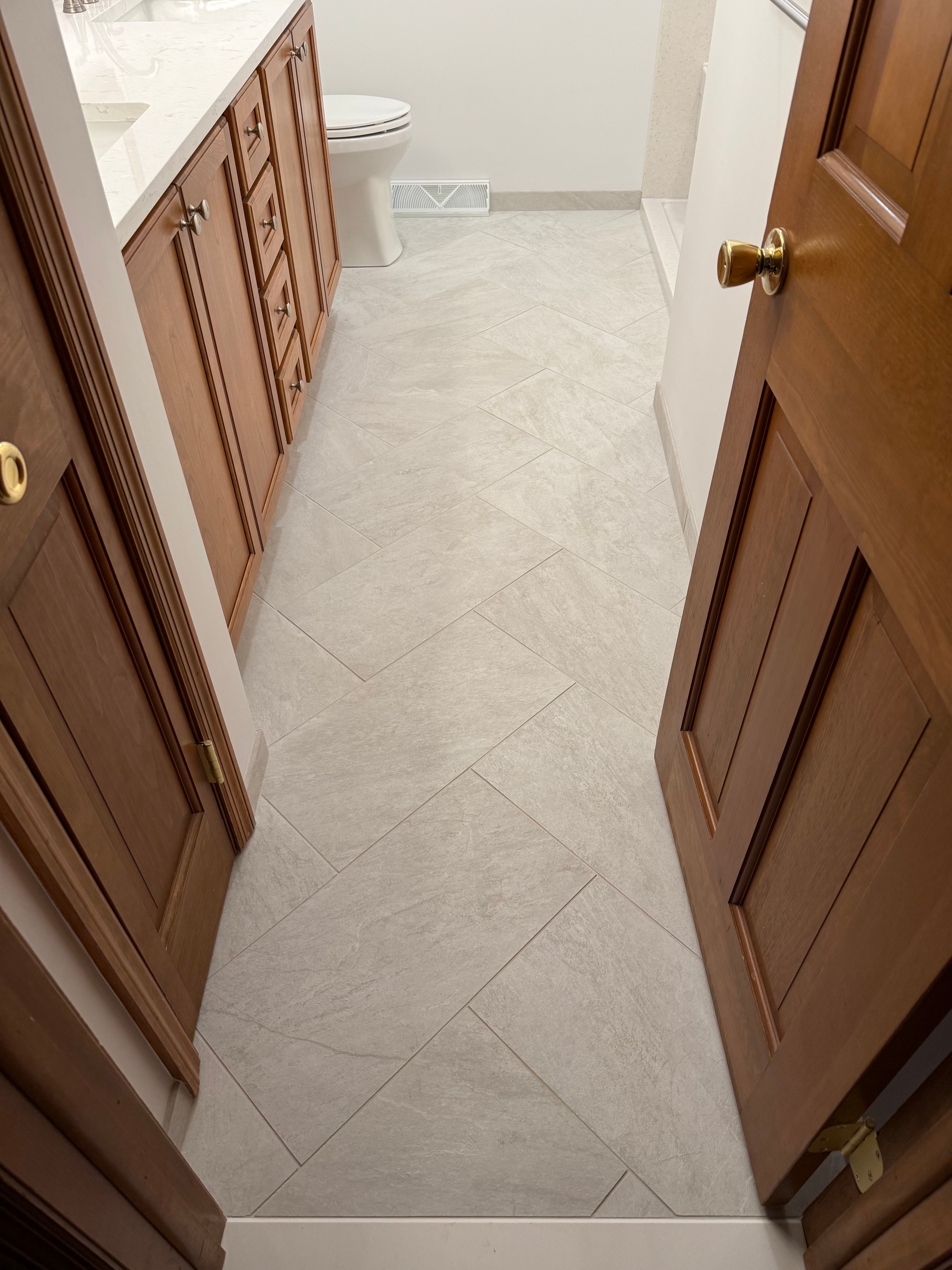 Clifton Park bathroom remodel - diagonal large-format tile floor detail