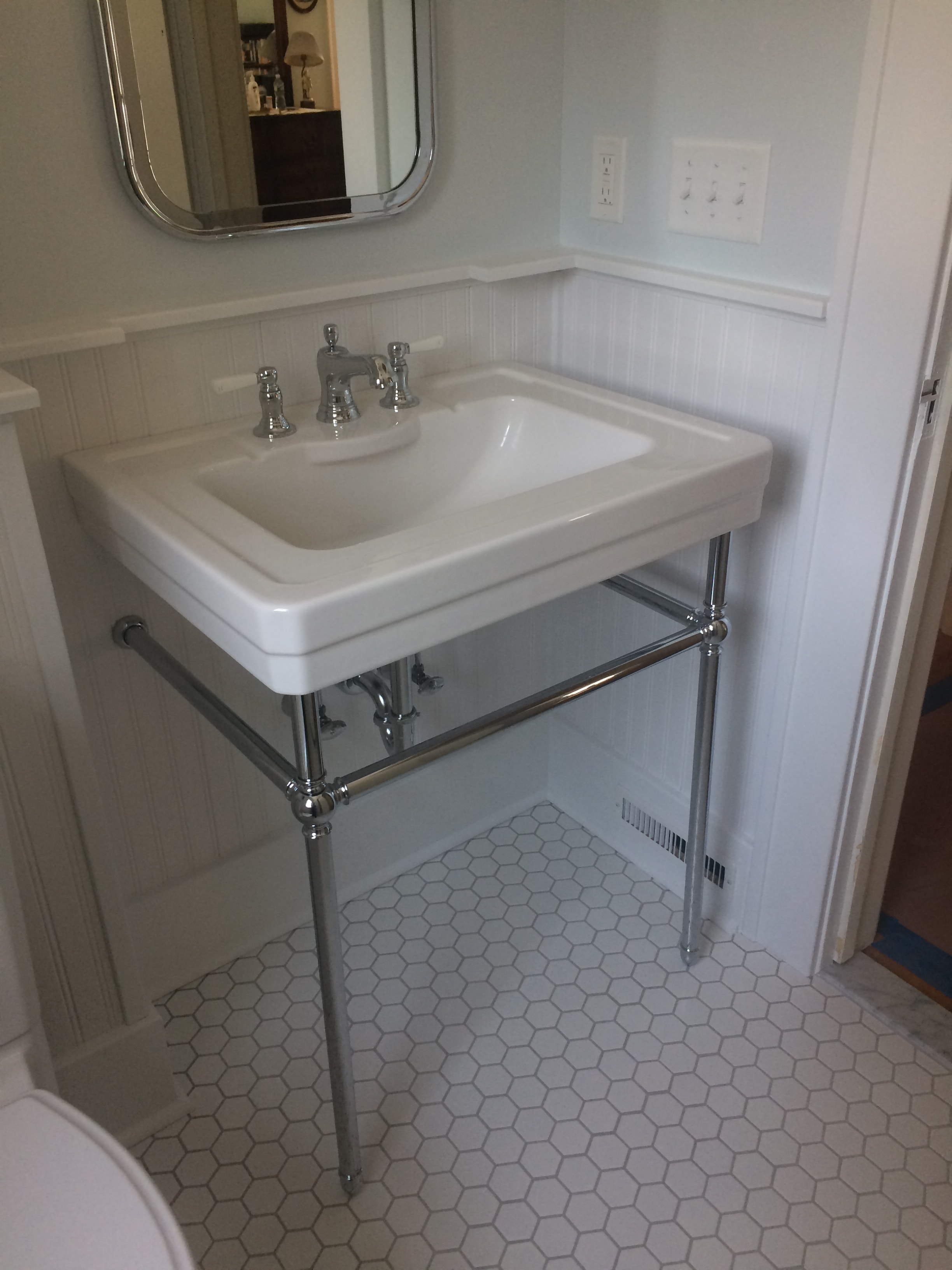 Niskayuna 2 bathroom remodel - pedestal sink with chrome legs, cross-handle faucets, and chrome mirror