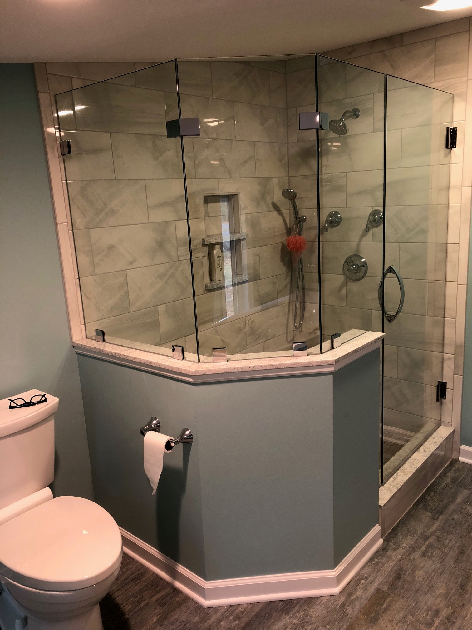 Saratoga Lake bathroom remodel - overhead view of frameless glass shower enclosure with marble-look tile and built-in niche
