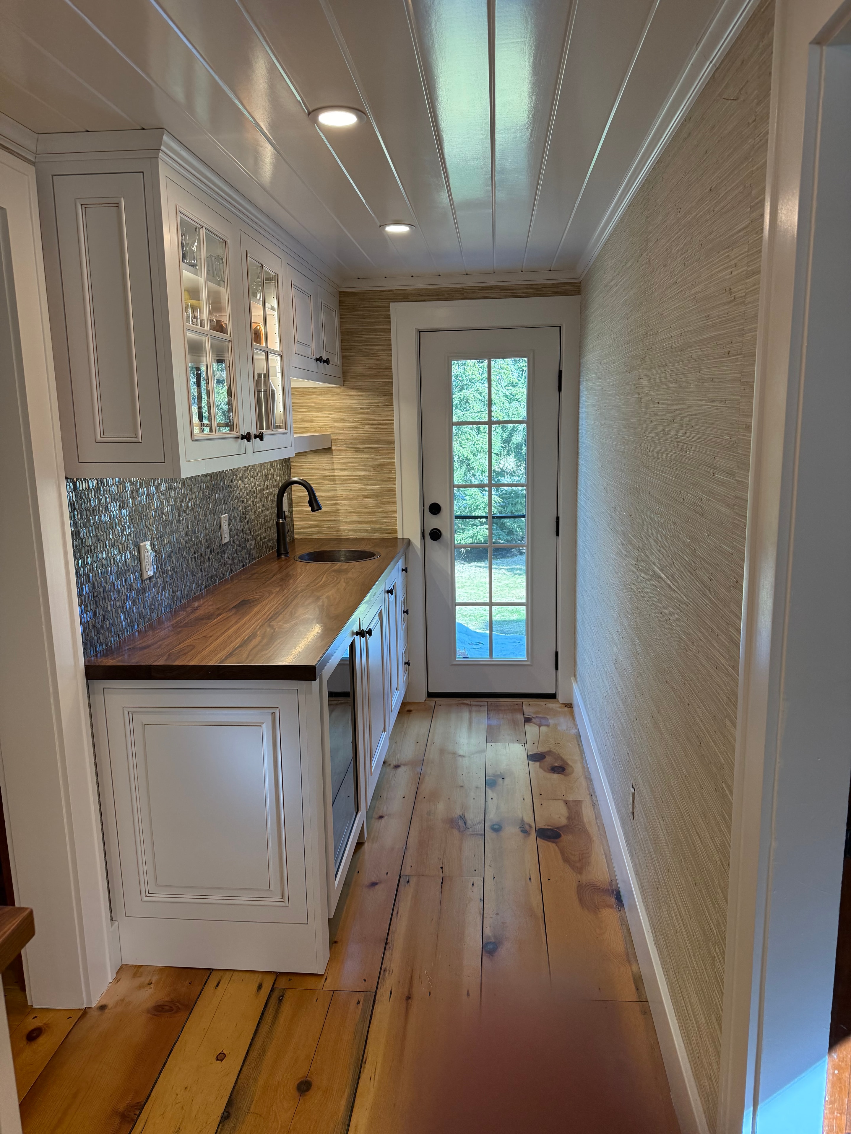 Coffee nook renovation - overhead wide shot showing full layout with white cabinetry and live-edge walnut countertop