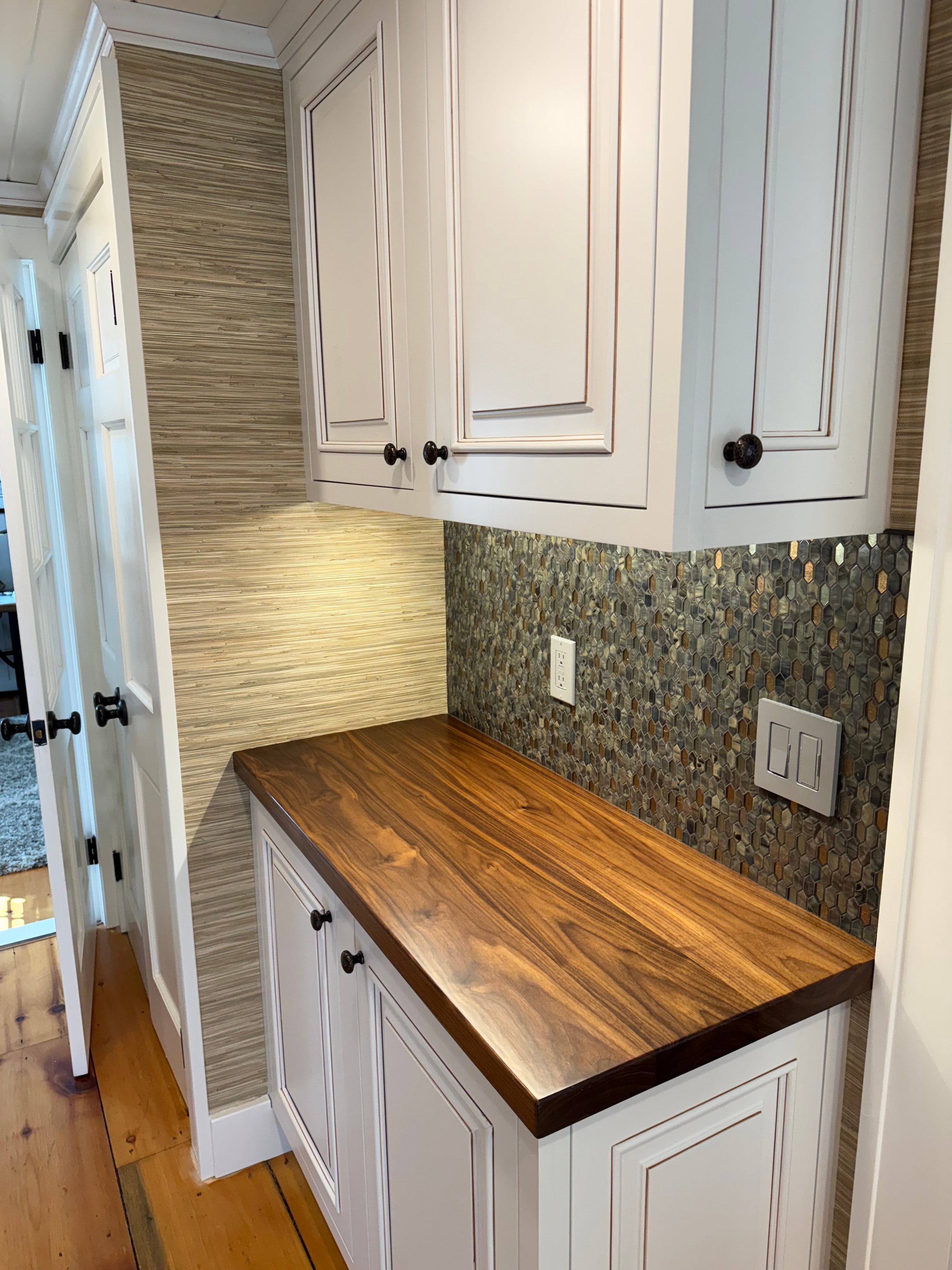 Coffee nook - close-up of live-edge walnut countertop and mosaic tile backsplash