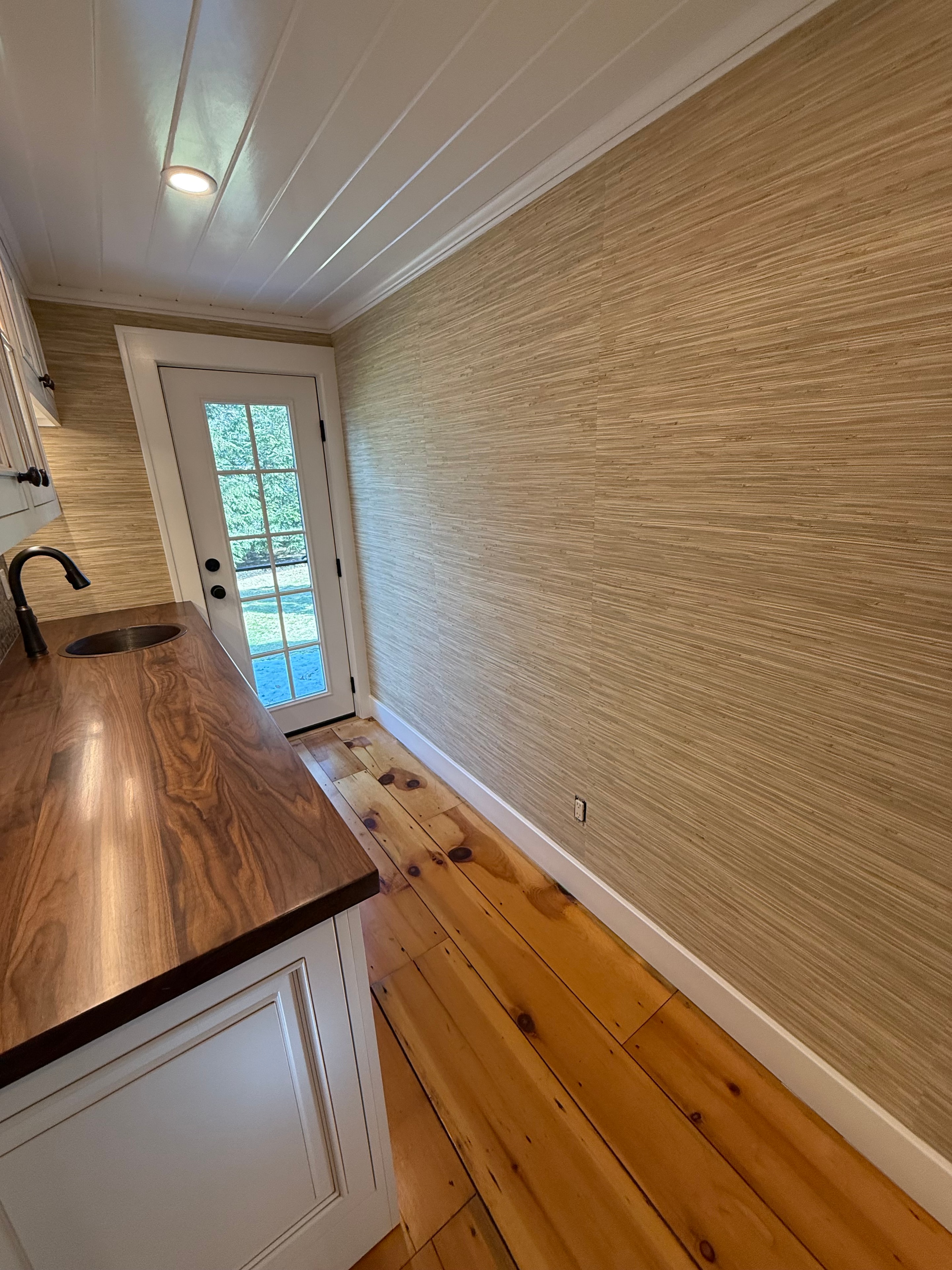 Coffee nook - grasscloth ceiling with window and walnut counter edge