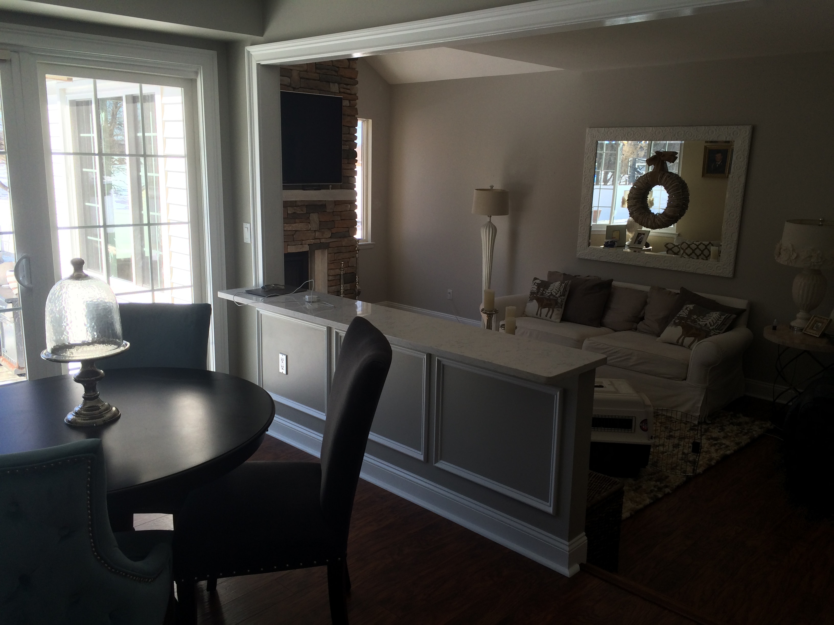 Loudonville kitchen remodel - open concept view with picture-frame wainscoting and stone fireplace