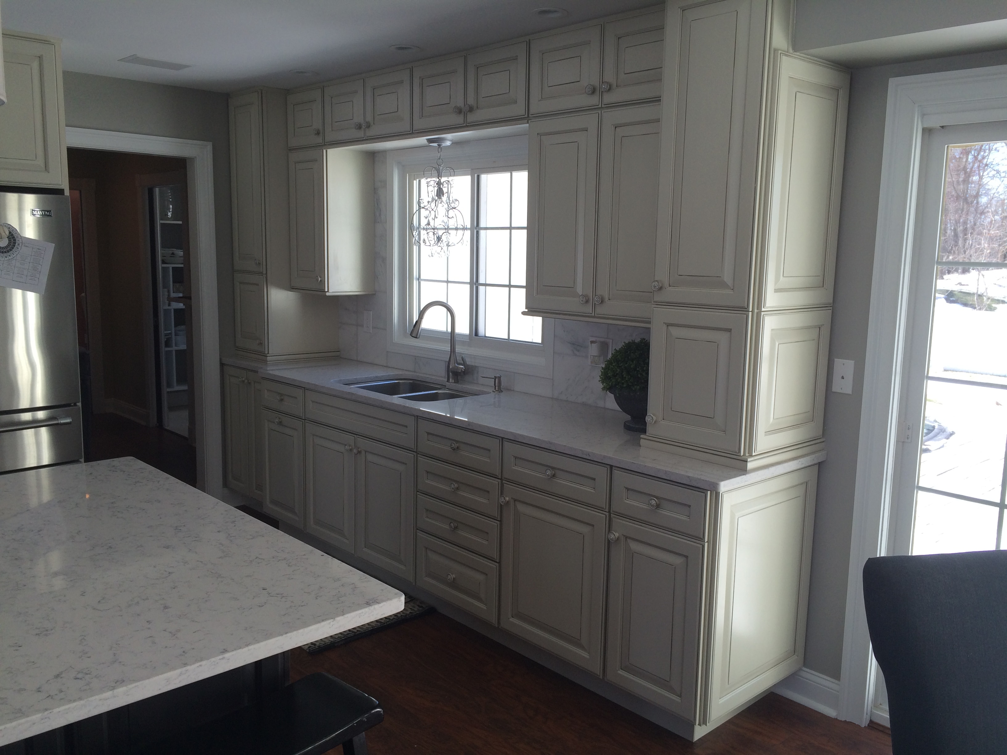 Loudonville kitchen remodel - sink wall with floor-to-ceiling cabinetry and marble backsplash