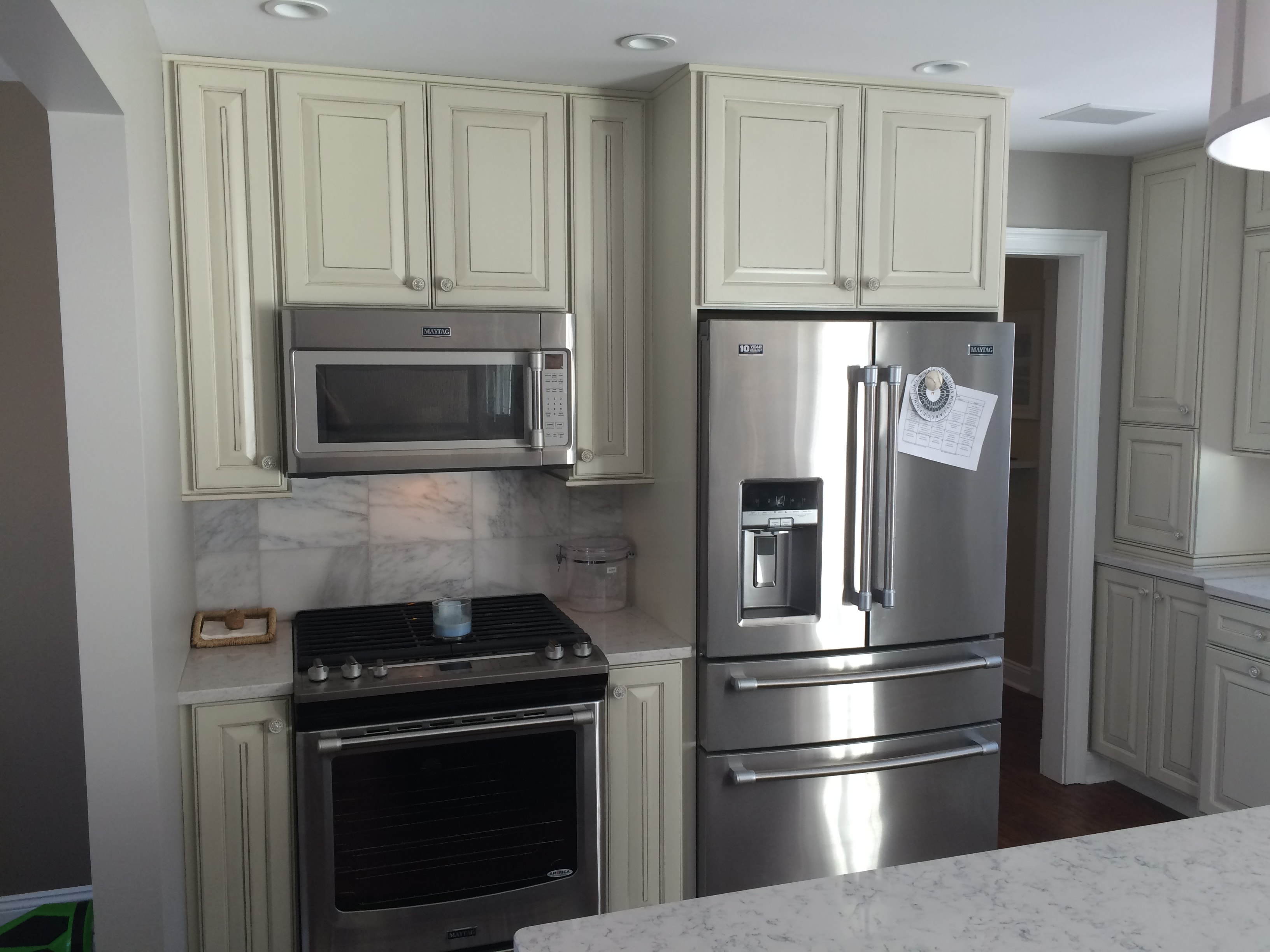 Loudonville kitchen remodel - appliance wall with range, microwave, and marble tile backsplash